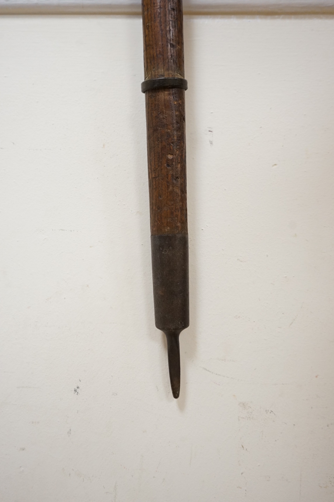 An early 20th century German mountaineer’s ice pick with oak shaft, the head stamped ‘Prima=Garantie Fulpmes’.